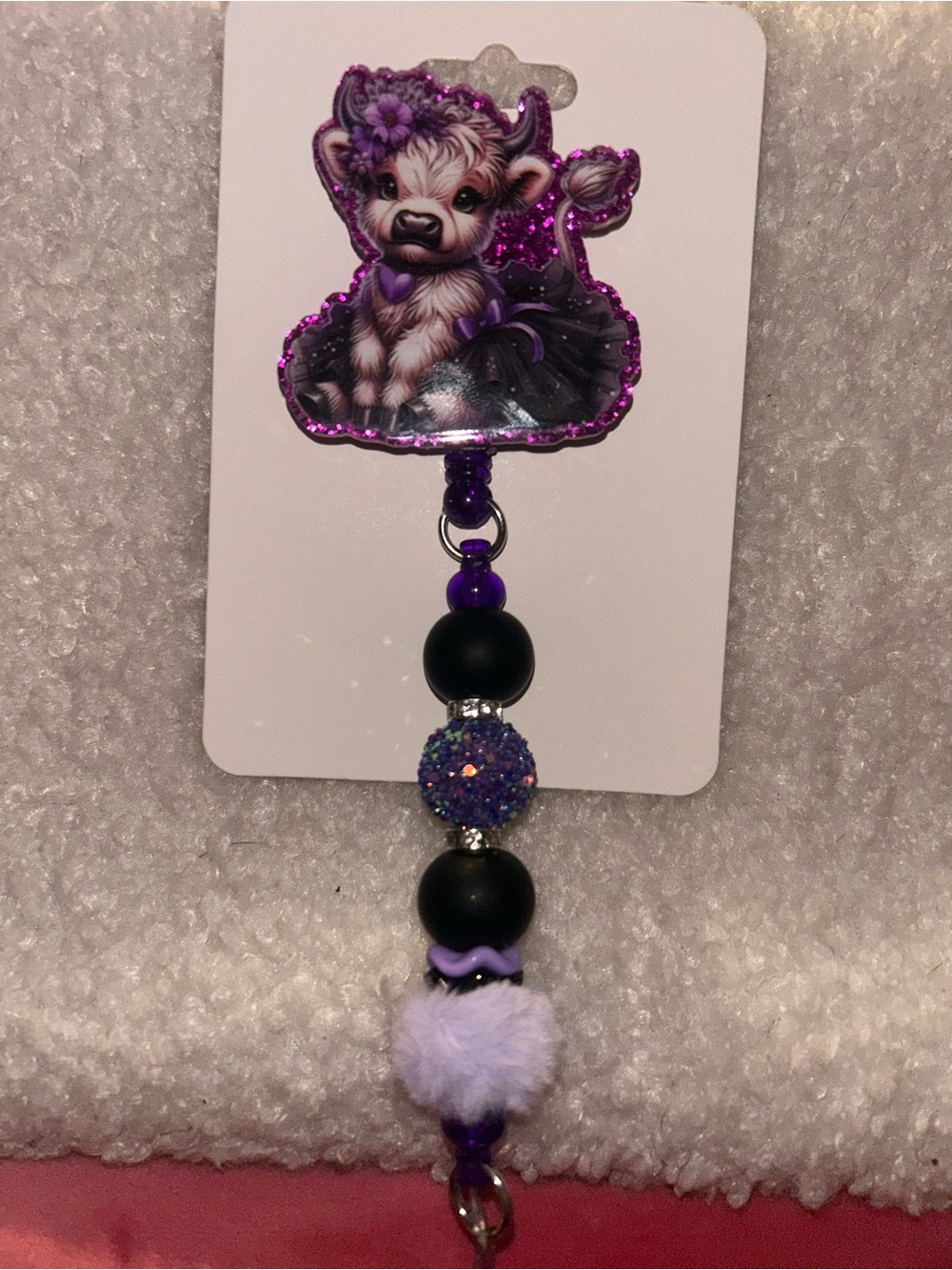 Highland cow Purple Glitter Pom-Bead badge reel